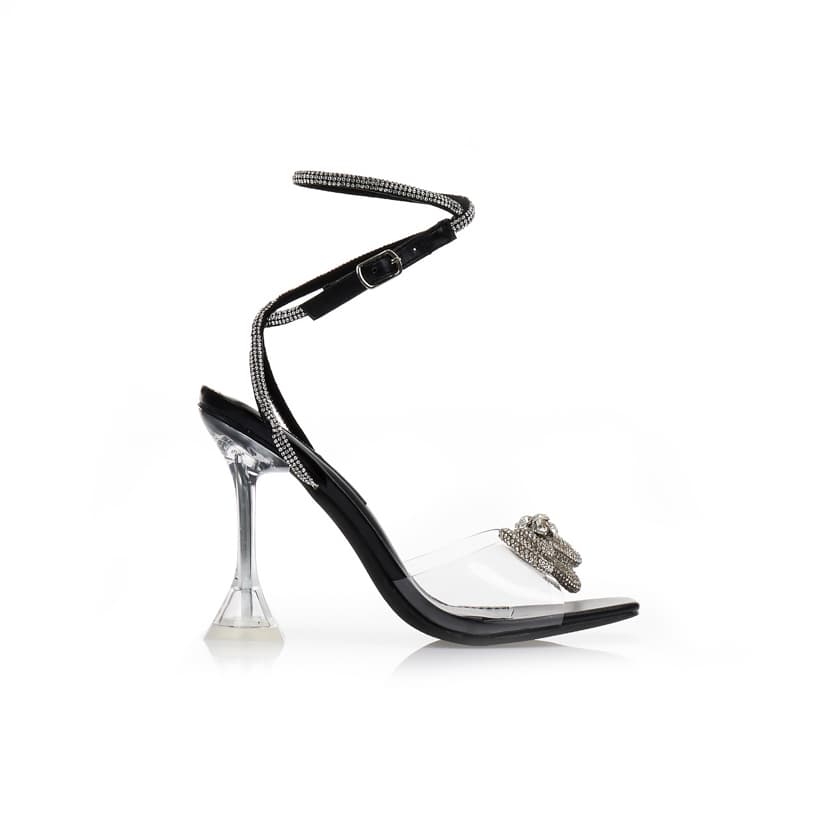 Πέδιλα μαύρα δερματίνη με διακοσμητικό φιόγκο από στρας και ιδιαίτερο τακούνι