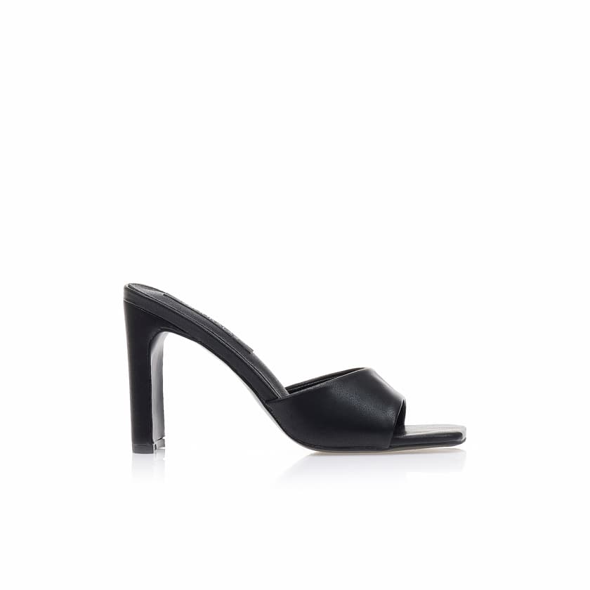 Mules λευκά δερματίνη με ιδιαίτερο τακούνι